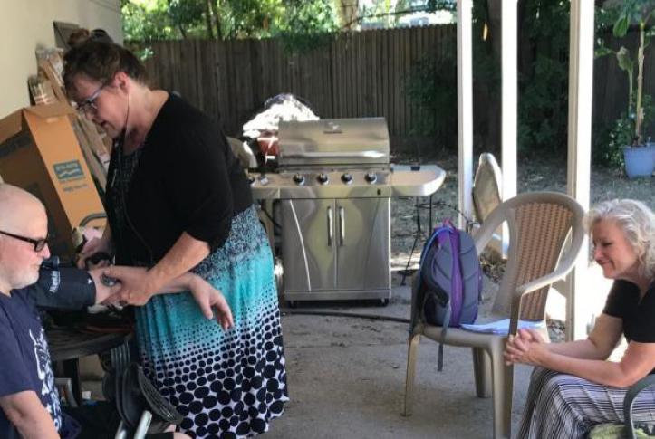 family member helps sick relative