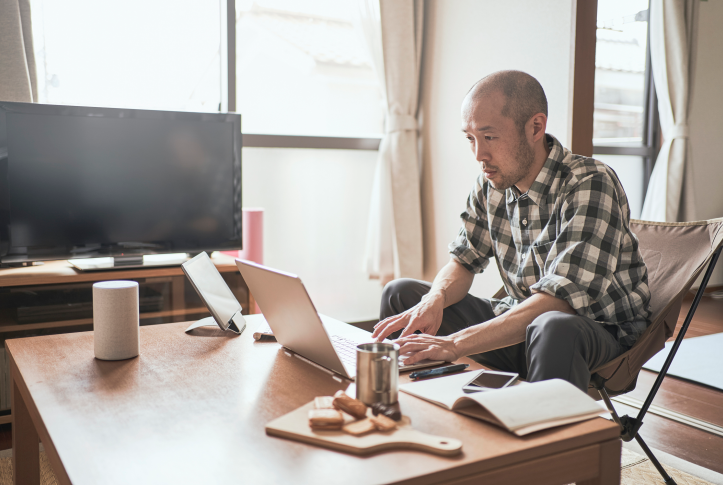 man looks at computer