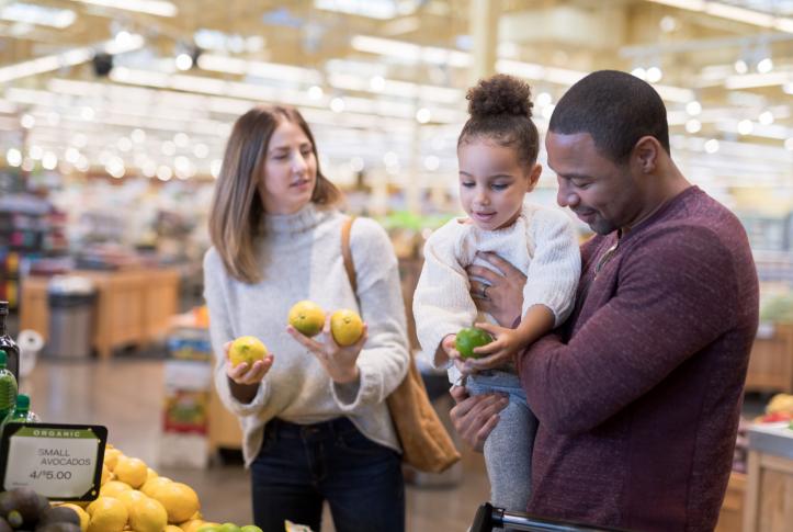 middle-income family shops for groceries