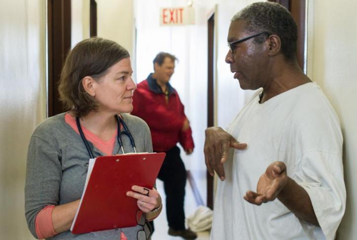 patient and doctor talk in hall