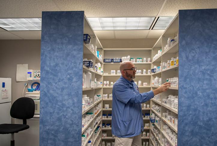pharmacist choosing medications for patient