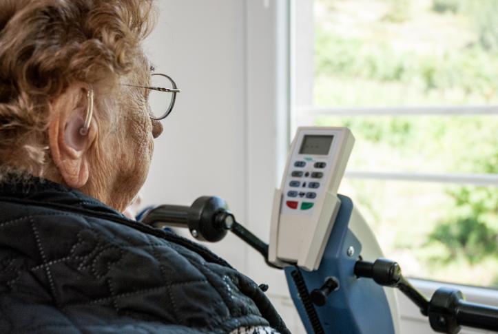 senior Medicare patient with hearing aid