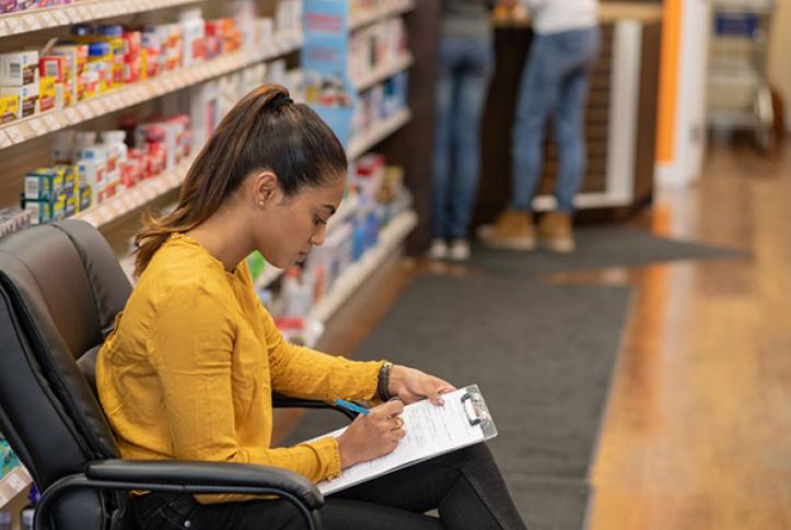 young adult registering for flu shot