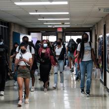 Teens walking in the hallway of Eleanor Roosevelt High School