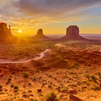 Panoramic view of Arizona dessert with sun setting in background