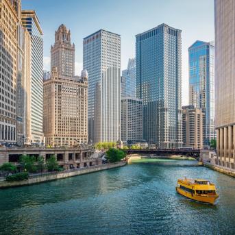 View of Downtown Chicago's skyscraper cityscape along the Chicago River in Illinois