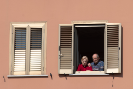Photo, Elderly couple stares out window