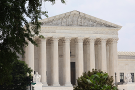 Photo, Supreme Court building lined by trees