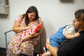 Mom feeds baby in waiting room