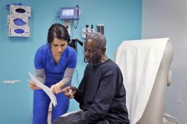 Nurse reviews surgery instructions with patient