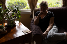 Woman sits in chair