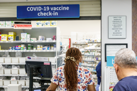 Customer at pharmacy check-in counter