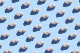 Repeated pills on the blue background