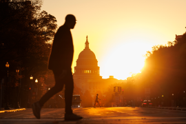 Pedestrian silhouette in front of US Capitol building