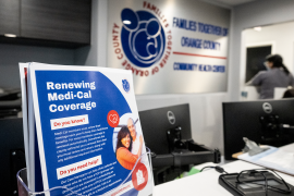 Sign for renewing Medicaid coverage in California on a check-in desk