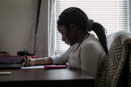 Abigail Previlon, 13, takes part in remote distance learning at home on Oct. 28, 2020, in Stamford, Conn.