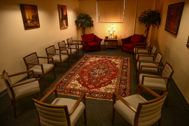 Room view of chairs around a rug