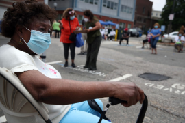 A woman waits to be tested for COVID-19 outside the Catherine Hardaway Residences in the Roxbury neighborhood of Boston, Mass., on July 8, 2020. A full day of free community-based testing for the elderly and people with disabilities took place at Central Boston Elder Services. Photo: Craig F. Walker for the Boston Globe via Getty Images